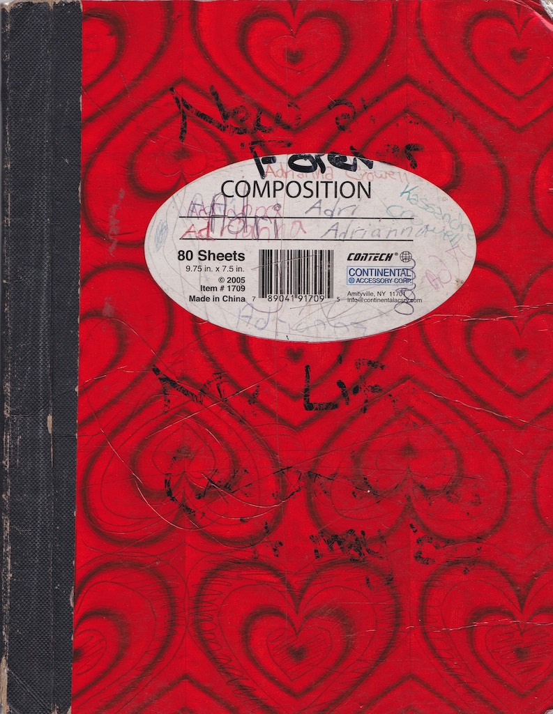 Red composition book with scribbles